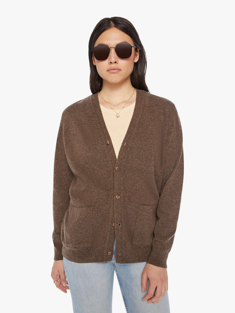 Front view of a woman cardigan in an earthy brown hue with V-neck, patch pockets and buttons down the front.