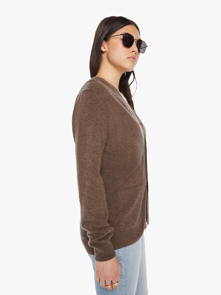 Side view of a woman cardigan in an earthy brown hue with V-neck, patch pockets and buttons down the front.