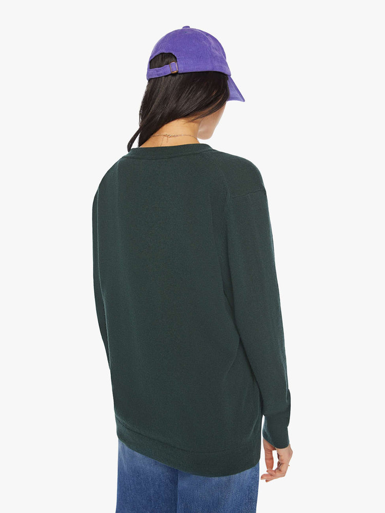 WOMEN back view of knit cardigan in a dark green hue with a V-neck, patch pockets and buttons down the front.