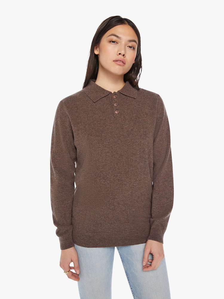 Front view of a woman polo in a brown hue with a collar, buttoned V-neck, long sleeves and a loose fit.