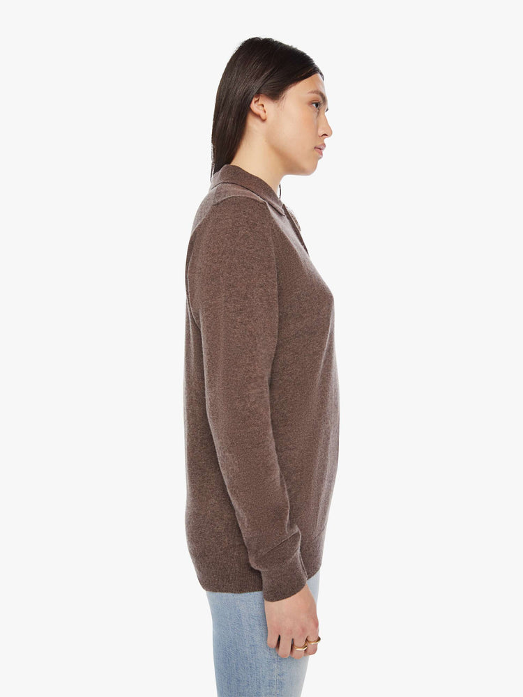 Side view of a woman polo in a brown hue with a collar, buttoned V-neck, long sleeves and a loose fit.
