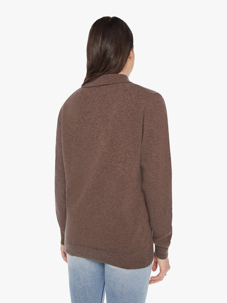 Back view of a woman polo in a brown hue with a collar, buttoned V-neck, long sleeves and a loose fit.