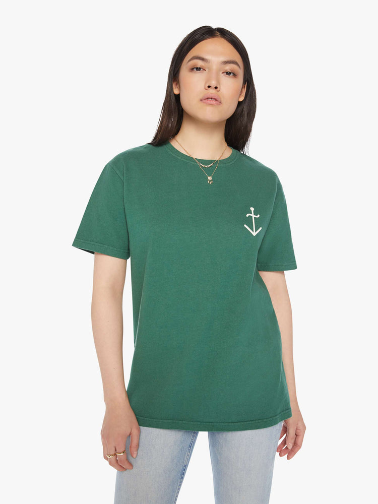 Front view of a woman green tee with a white anchor on the chest, has a ribbed crewneck and a straight fit.
