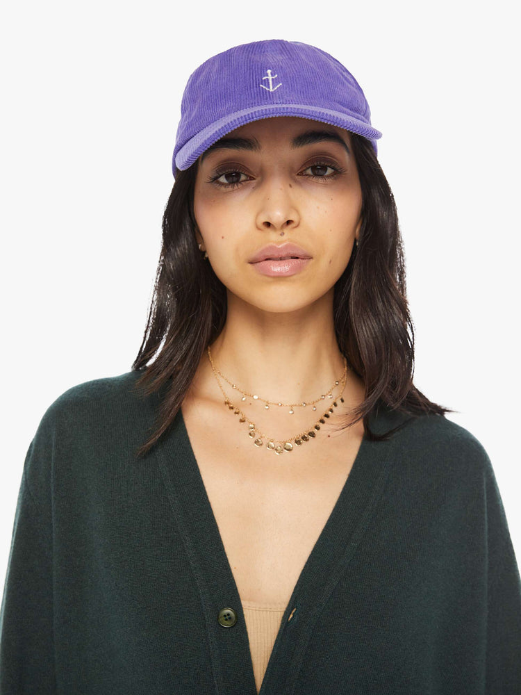 WOMEN front view of a woman purple hue corduroy hat with a white anchor on the front.