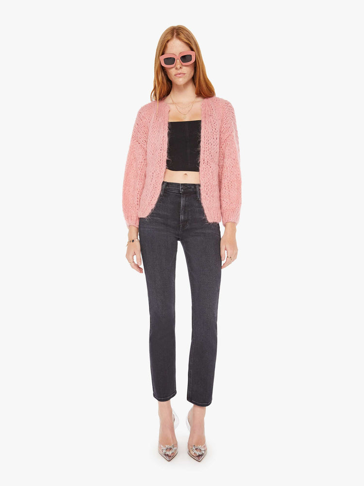 Front full body view of a womens chunky knit cardigan in a soft pink hue featuring cropped billow sleeves.