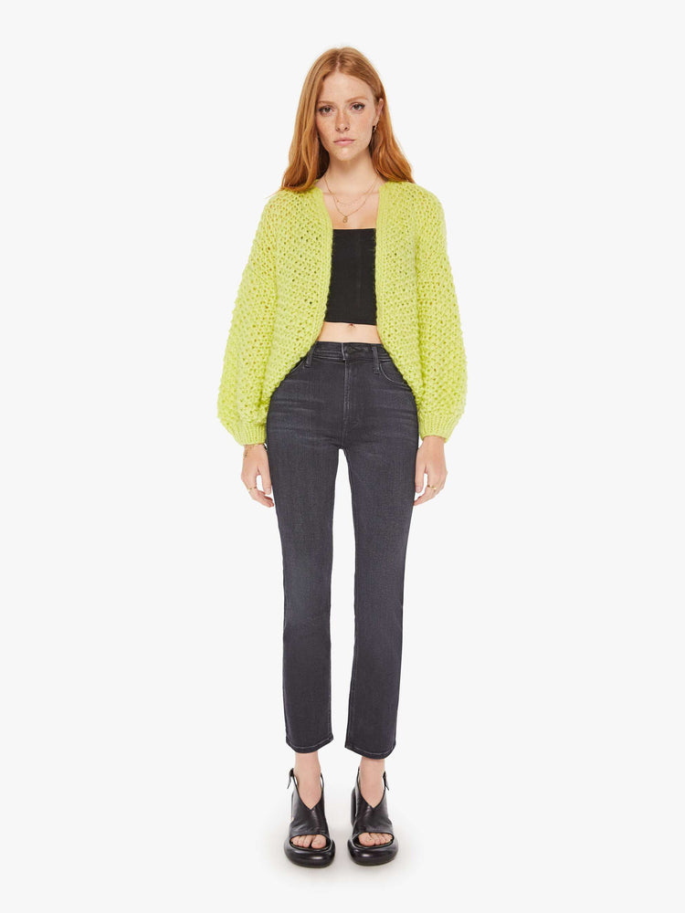 Front full body view of a womens chunky knit cardigan in a neon yellow hue featuring cropped billow sleeves.