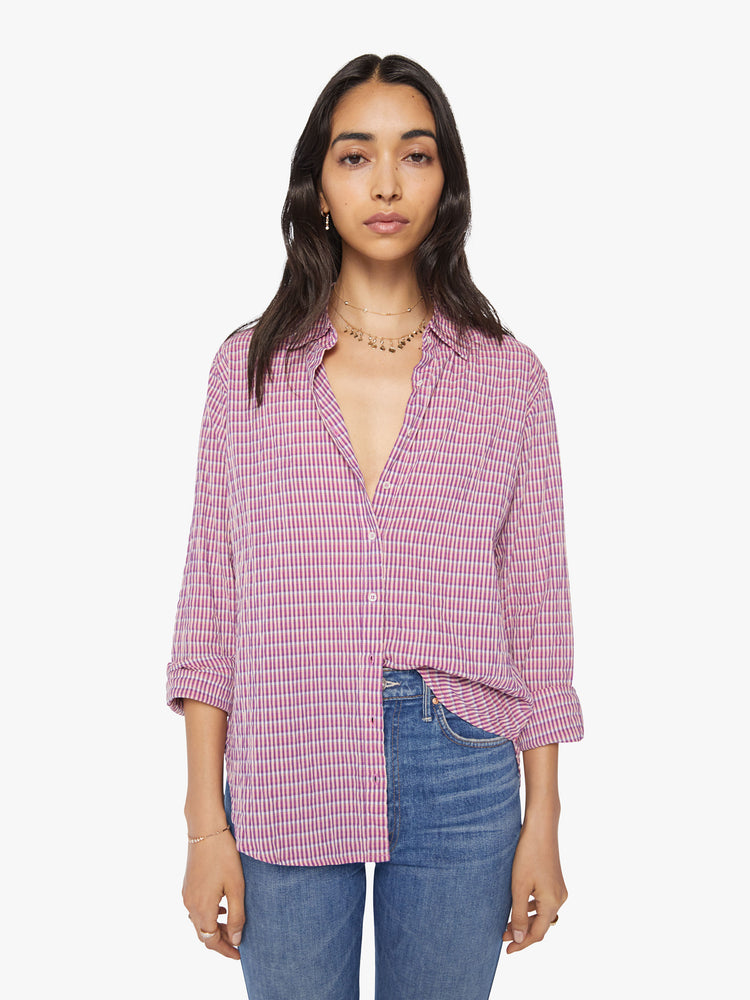 Front view of a woman coral-pink button down.