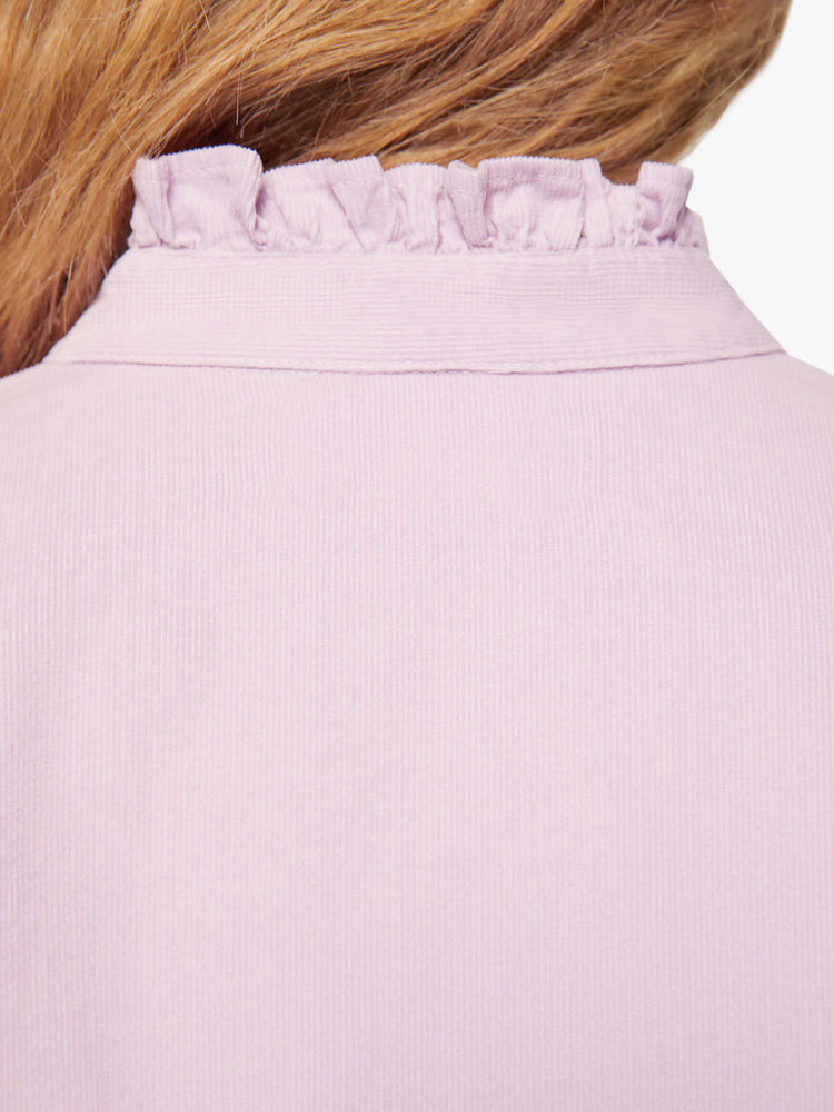 Swatch view of a woman soft lilac shirt with a ruffled V-neck that buttons, drop shoulders, long sleeves, a cropped hem and a boxy fit.