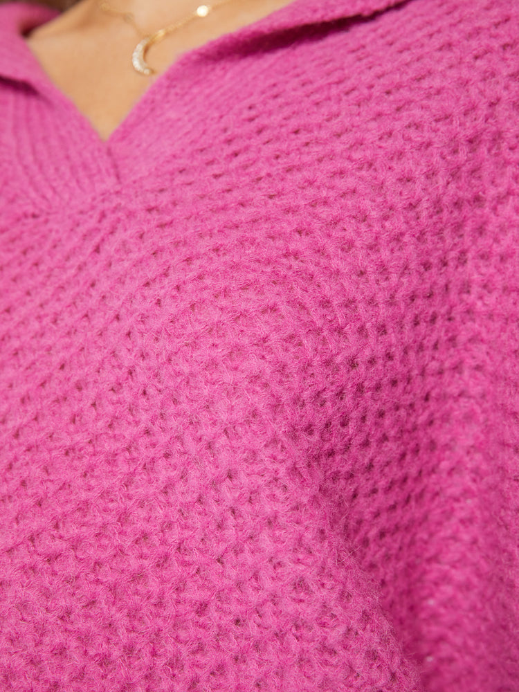 Swatch  view of a woman's oversized collar, V-neck, long balloon sleeves and a loose fit in a hot pink hue.