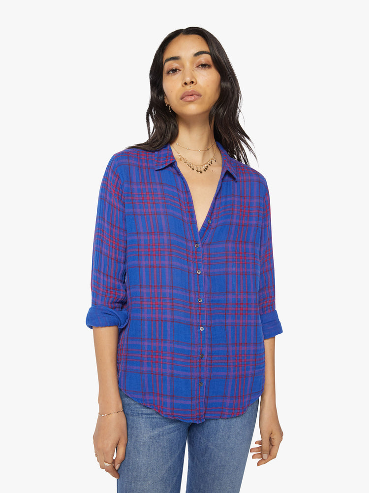 Front view of a women blue plaid button-down long-sleeve shirt features a V-neck and curved hem with a light and airy fit.