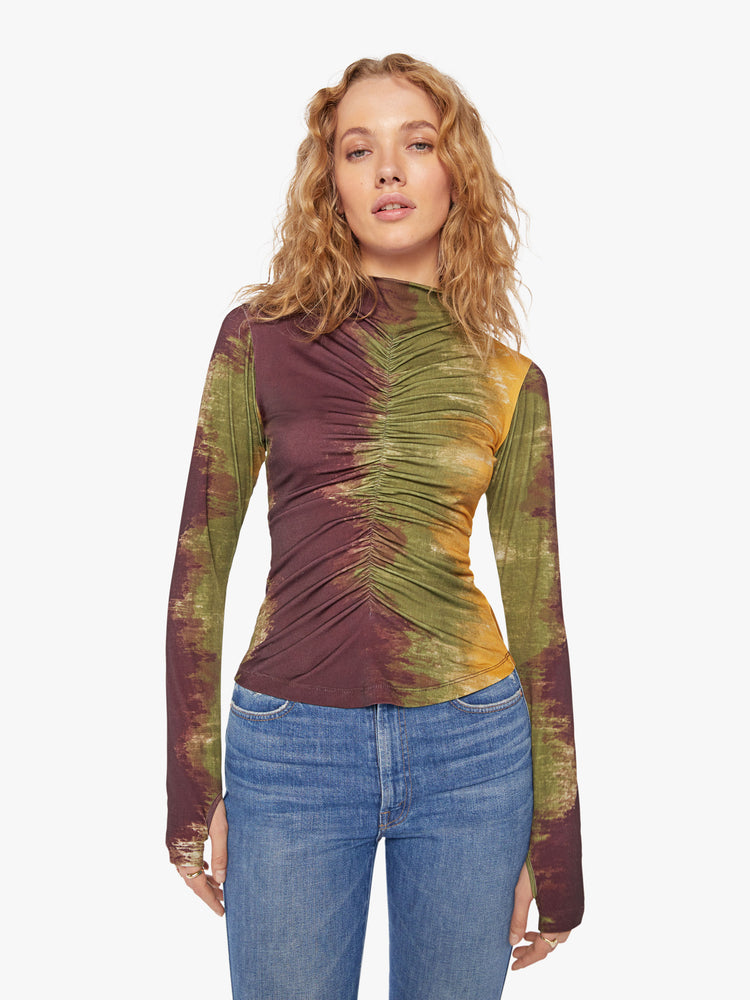 Front view of a woman long sleeve turtleneck in bold prints and modern neutrals, with a gathered seam down the front, thumbholes and a narrow fit. 