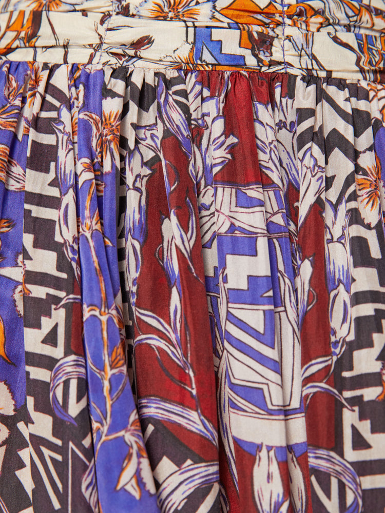 Swatch view of a woman maxi skirt in bold prints and modern neutrals, with a super high rise, tiered skirt, uneven hem and a flowy fit.