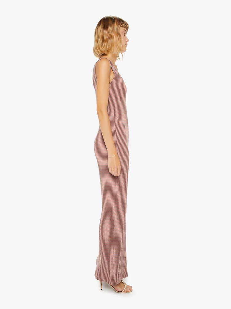 Side view of a woman sleeveless maxi dress in fine multicolored stripes, and features a scoop neck, narrow fit and an ankle-length hem.
