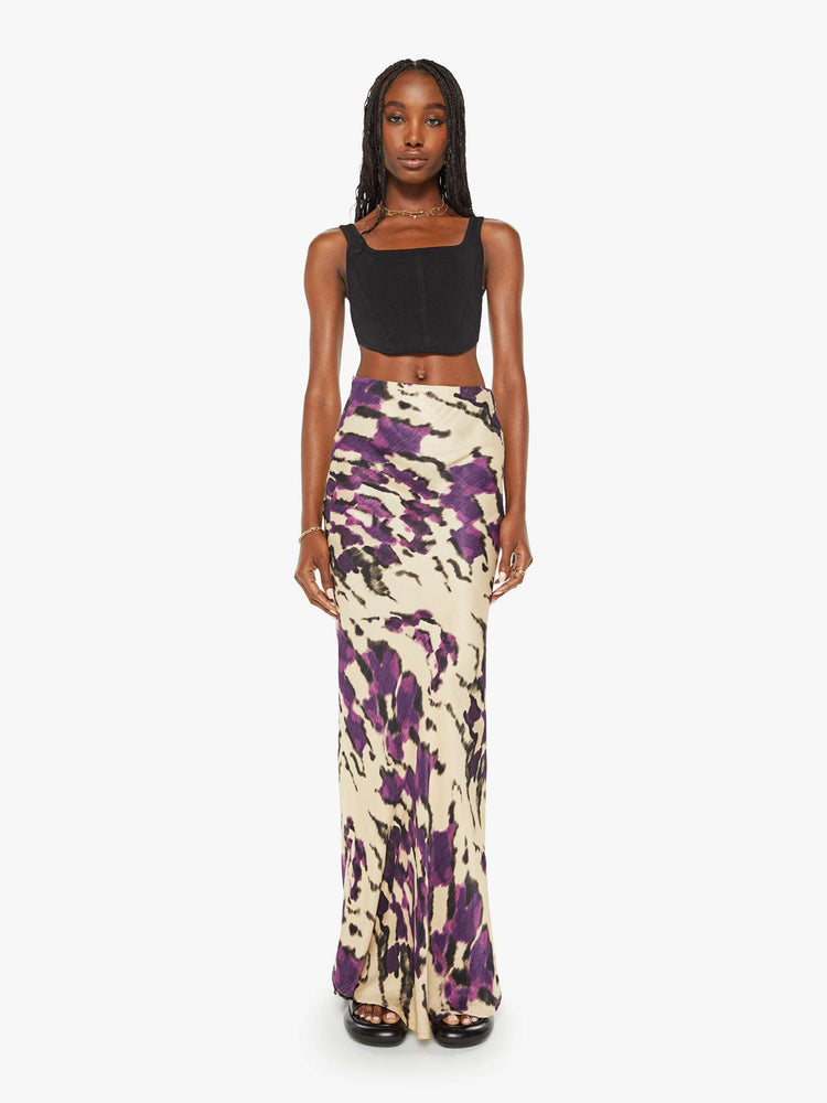 Front view of a woman violet and cream abstract print kirt features a high rise, slim fit and long hem.