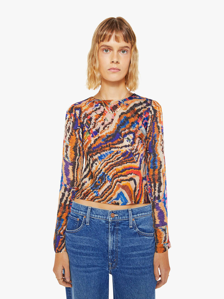 Front view of a woman colorful abstract print top with  crew neck, long sleeves and a slightly cropped hem.