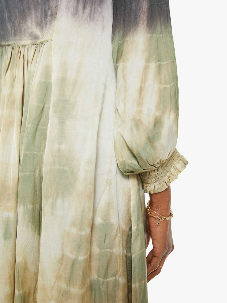 Swatch view of a woman maxi dress with a V-neck, cropped balloon sleeves and a loose, flowy fit in grey, green, orange, and blue ombre.