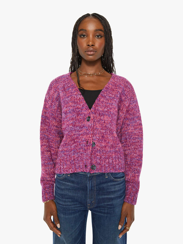 Front view of a woman magenta hue sweater with a V-neck, long sleeves, ribbed hems and buttons down the front.