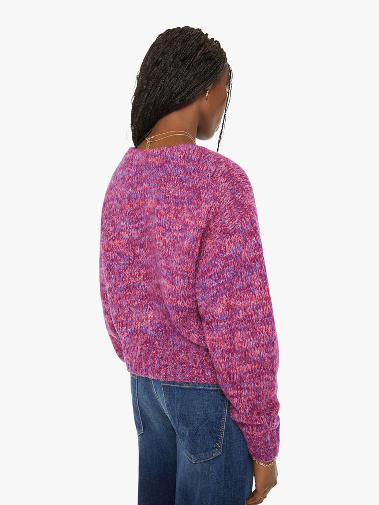 Back view of a woman magenta hue sweater with a V-neck, long sleeves, ribbed hems and buttons down the front.