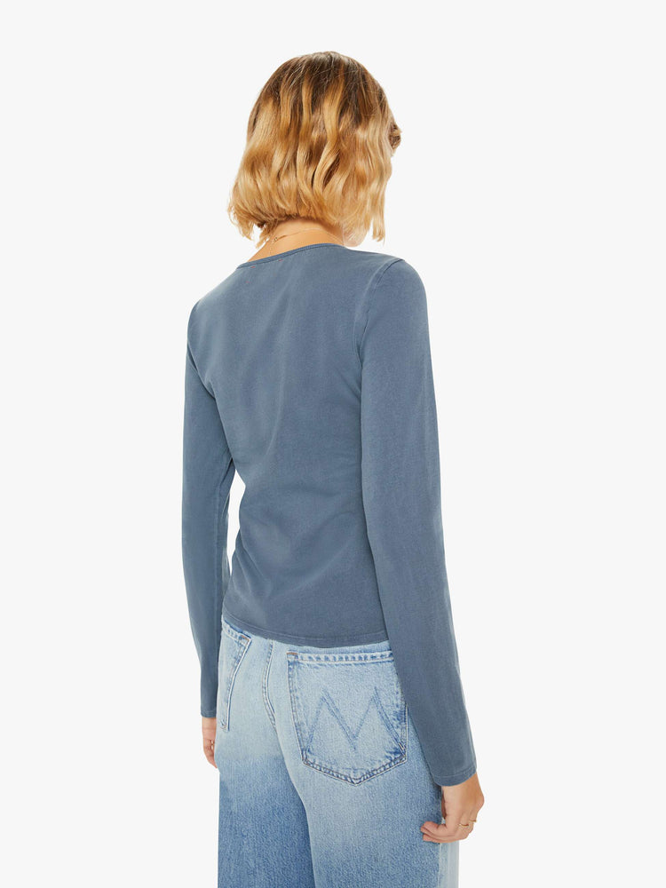 Back view of a woman navy hue long sleeve with a V-neck, gathered seam down the front and a slim fit.