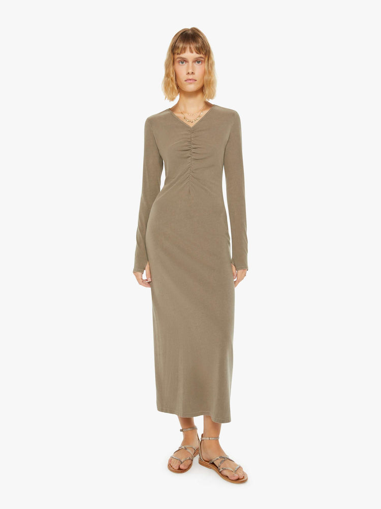 Front view of a woman dusty oluve hue long sleeve dress with a V-neck, gathered seam down the front and a slim fit.