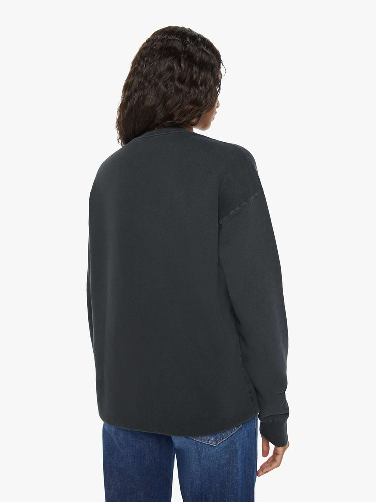 WOMEN back view of a black sweatshirt pays homage to Led Zeppelin's 1977 tour with a faded green Icarus graphic with text in white on the front.