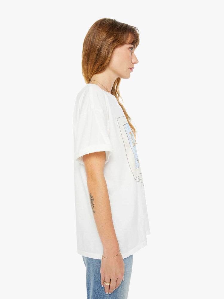 WOMEN side view of a woman white crewneck tee, drop shoulders and a slightly oversized fit features a colorful hand-drawn graphic of a computer screen on the front.