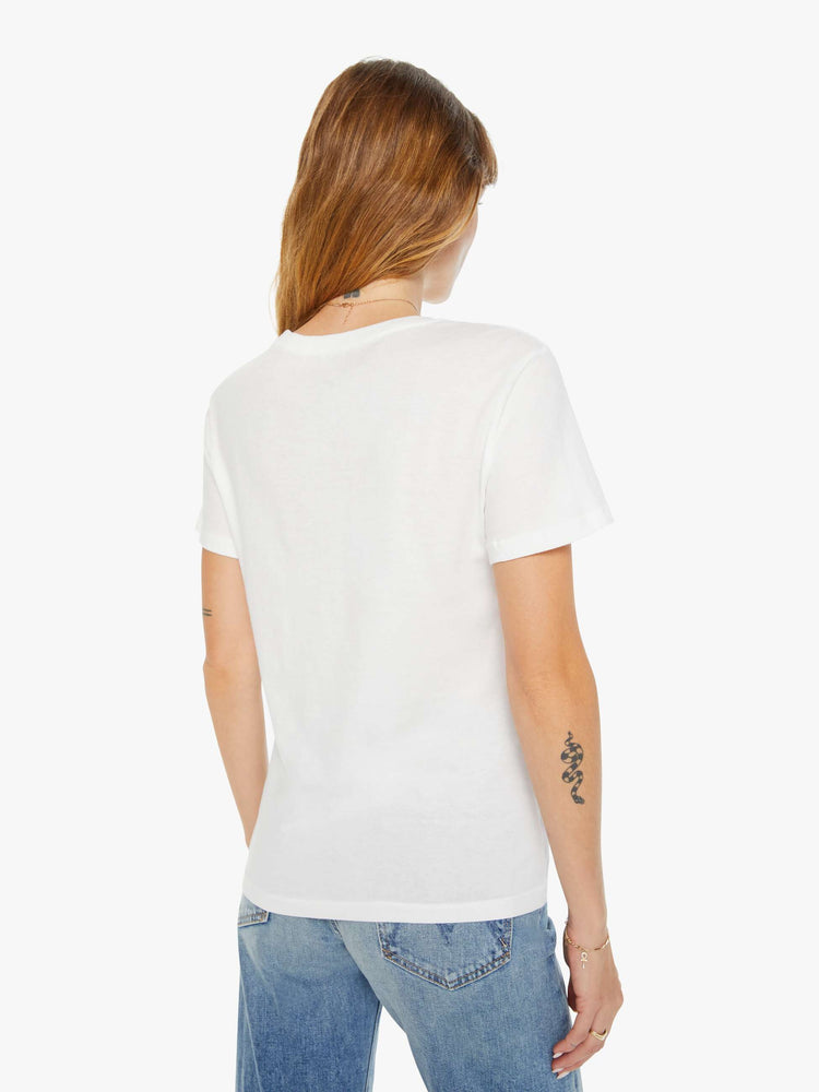 Back view of a woman white tee features a colorful hand-drawn pickleball graphic on the front.