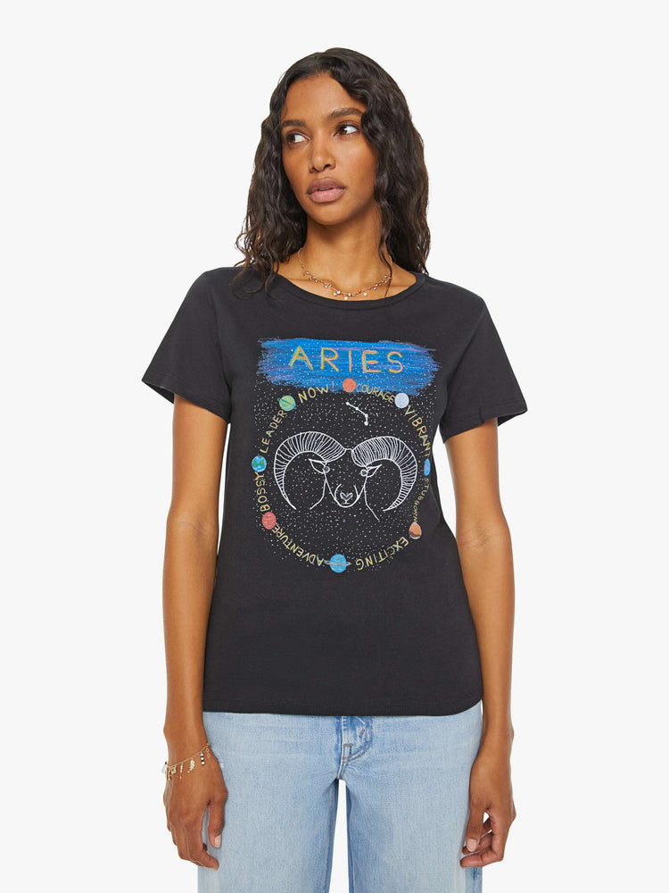 Front view of a woman black tee features a colorful, hand-drawn graphic depicting the Aries ram.