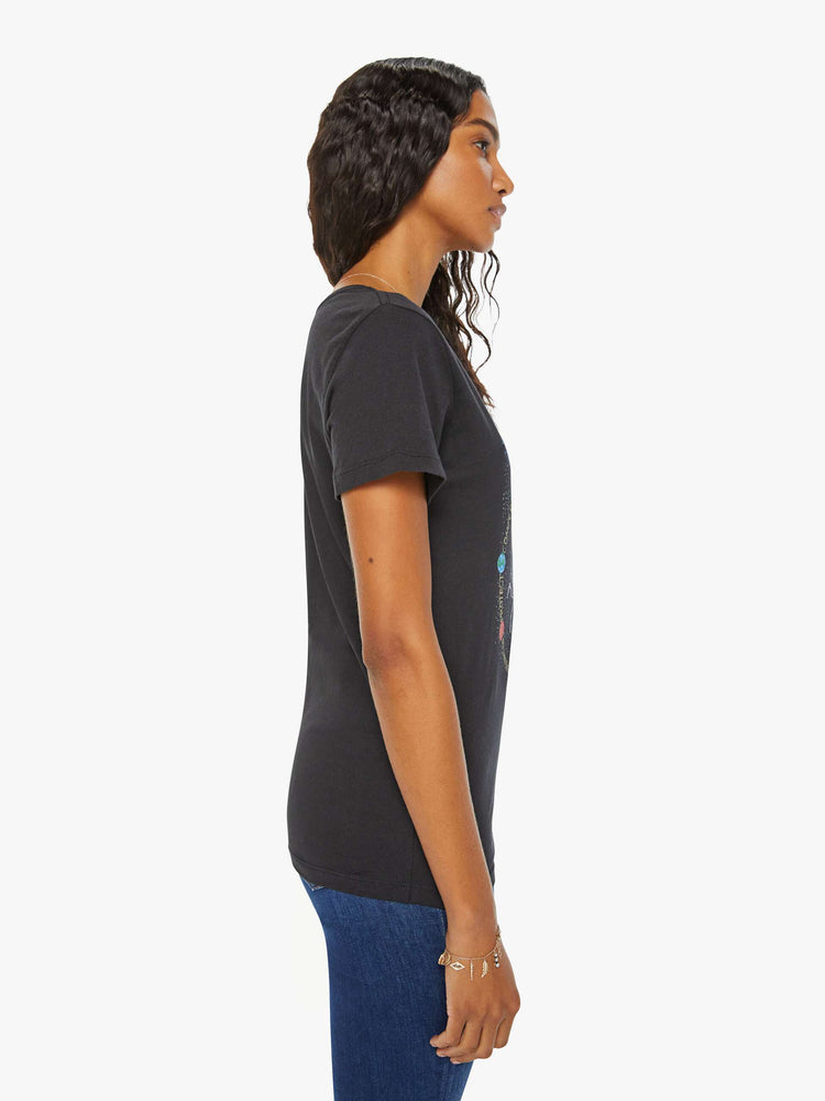 Side view of a woman in a black tee features the crab of the Cancer, the fourth astrological sign in the zodiac.