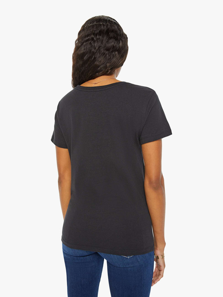 Back view of a woman in a black tee features the crab of the Cancer, the fourth astrological sign in the zodiac.