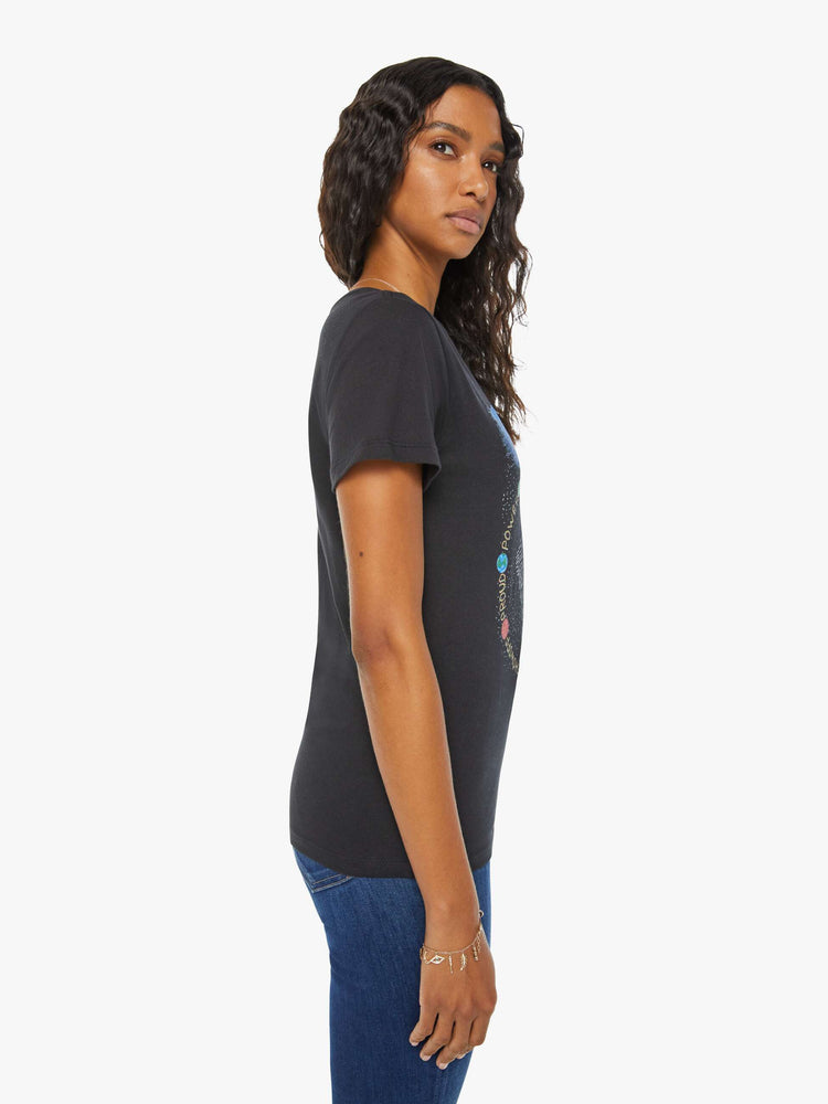 Side  view of a woman in a black tee features the Leo lion, the fifth astrological sign in the zodiac.