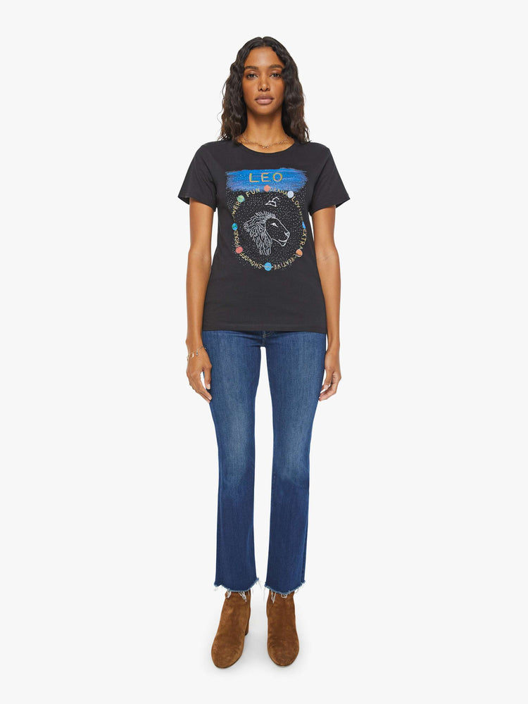 Full body  view of a woman in a black tee features the Leo lion, the fifth astrological sign in the zodiac.
