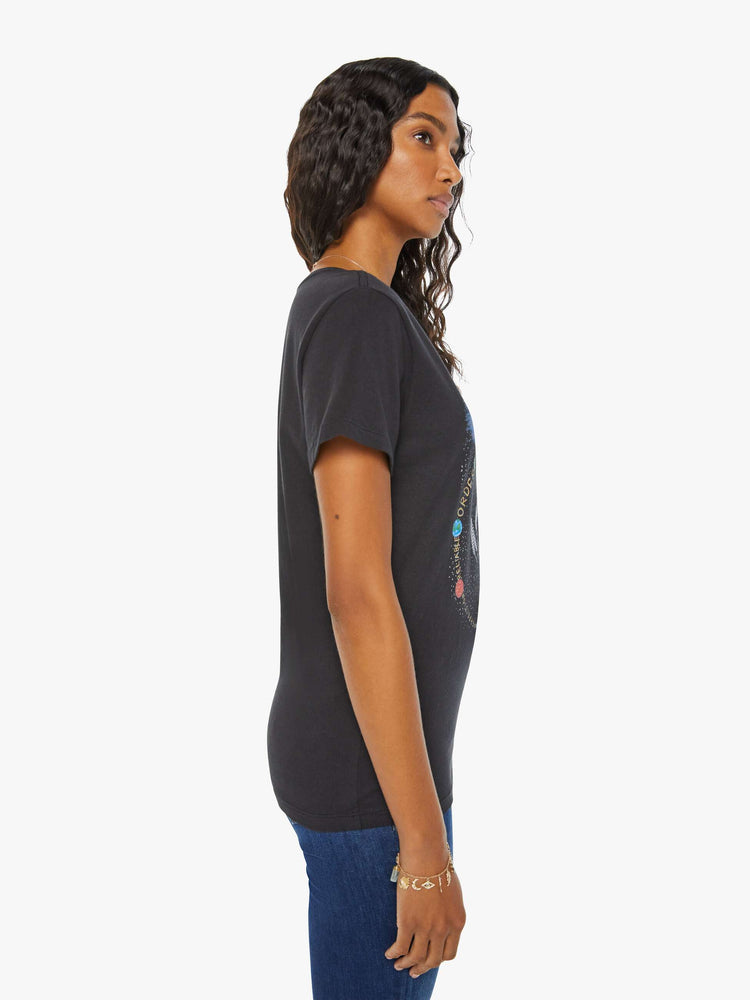 Side view of a woman black tee eatures the Virgo maiden, the sixth astrological sign in the zodiac.