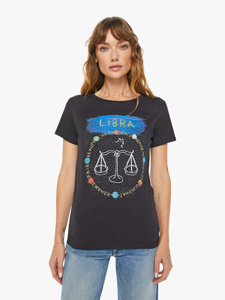 Front view of a woman black tee features the Libra scale, the seventh astrological sign in the zodiac.