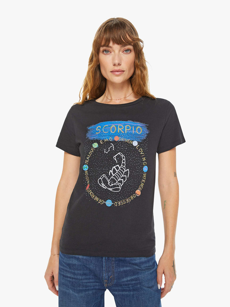 Front view of a woman black tee features a scorpion, the symbol of the eighth astrological sign in the zodiac, Scorpio.