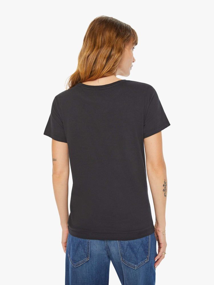 Back view of a woman black tee features a scorpion, the symbol of the eighth astrological sign in the zodiac, Scorpio.