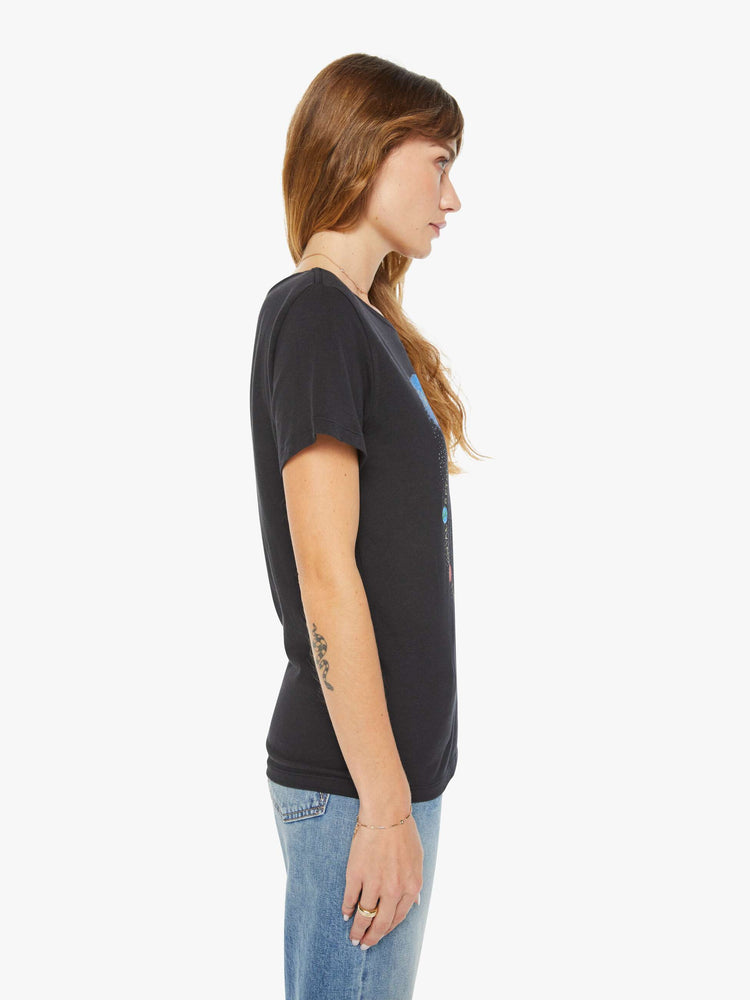 Side view of a woman black tee features an archer, the symbol of the Sagittarius.