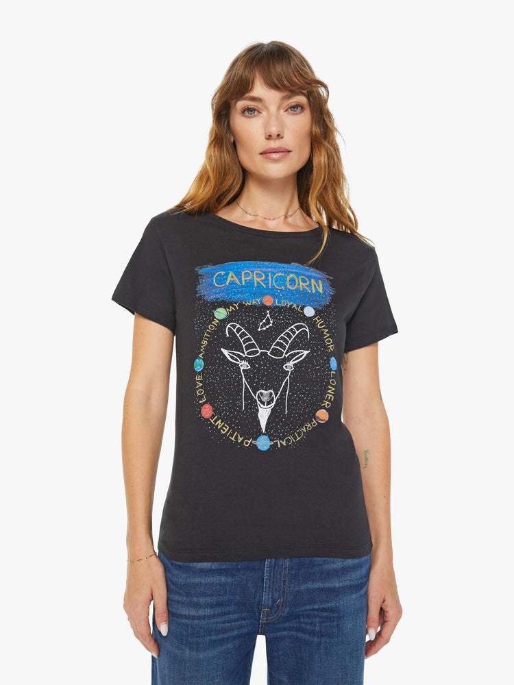Front view of a woman black tee features a sea-goat, the symbol of the Capricorn.