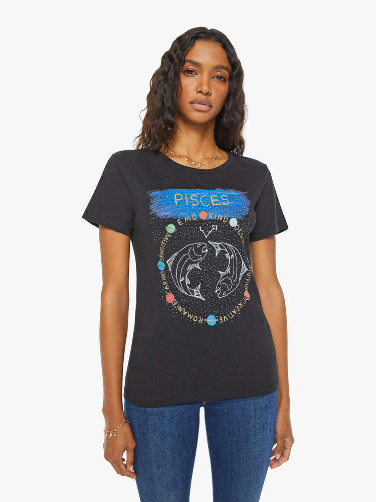 Front view of a woman black tee  features the symbol of the water sign, Pisces — two fish swimming in opposite directions.