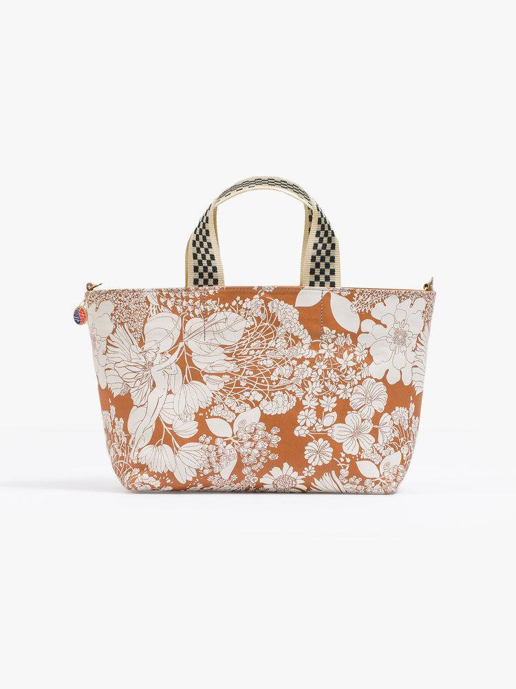 Front view of a rectangular bag features a zip closure and checkered top handle, and is designed in French Fairy Tale, a brown and white floral print.