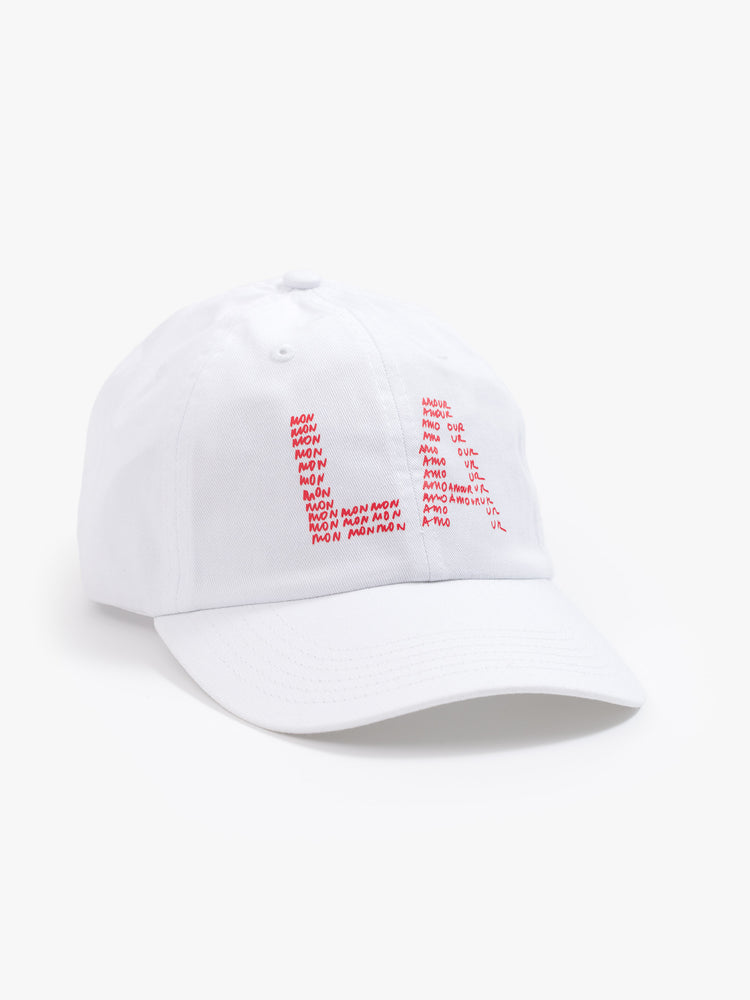 Front view of a woman white hat and is designed with a red text graphic on the front.