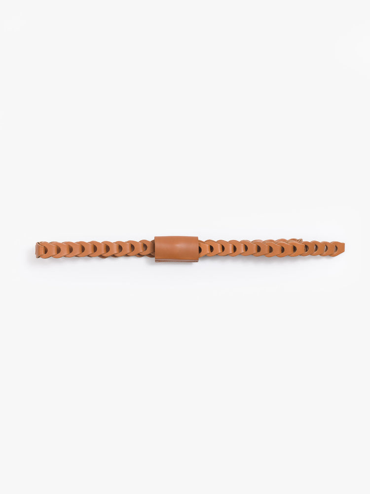 Flat view of a light brown belt features an interlocking braided leather design with a brass buckle and an embossed tab on the back.