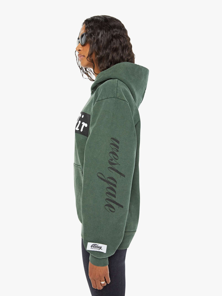 WOMEN sweatshirt in forest green has a front patch pocket, ribbed hems and a slightly oversized fit referencing the Los Angeles Neighborhood.