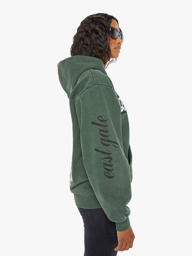 WOMEN left side view sweatshirt in forest green has a front patch pocket, ribbed hems and a slightly oversized fit referencing the Los Angeles Neighborhood.