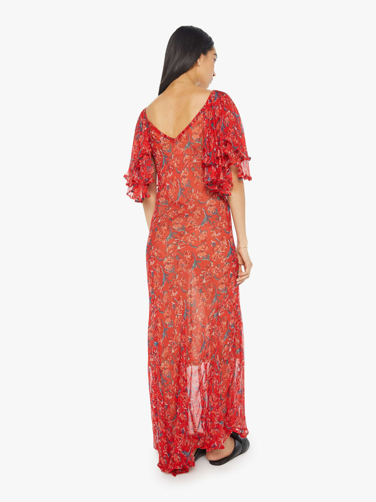 Back view of womens long dress featuring a red floral print, a deep v neck, and ruffled sleeves.