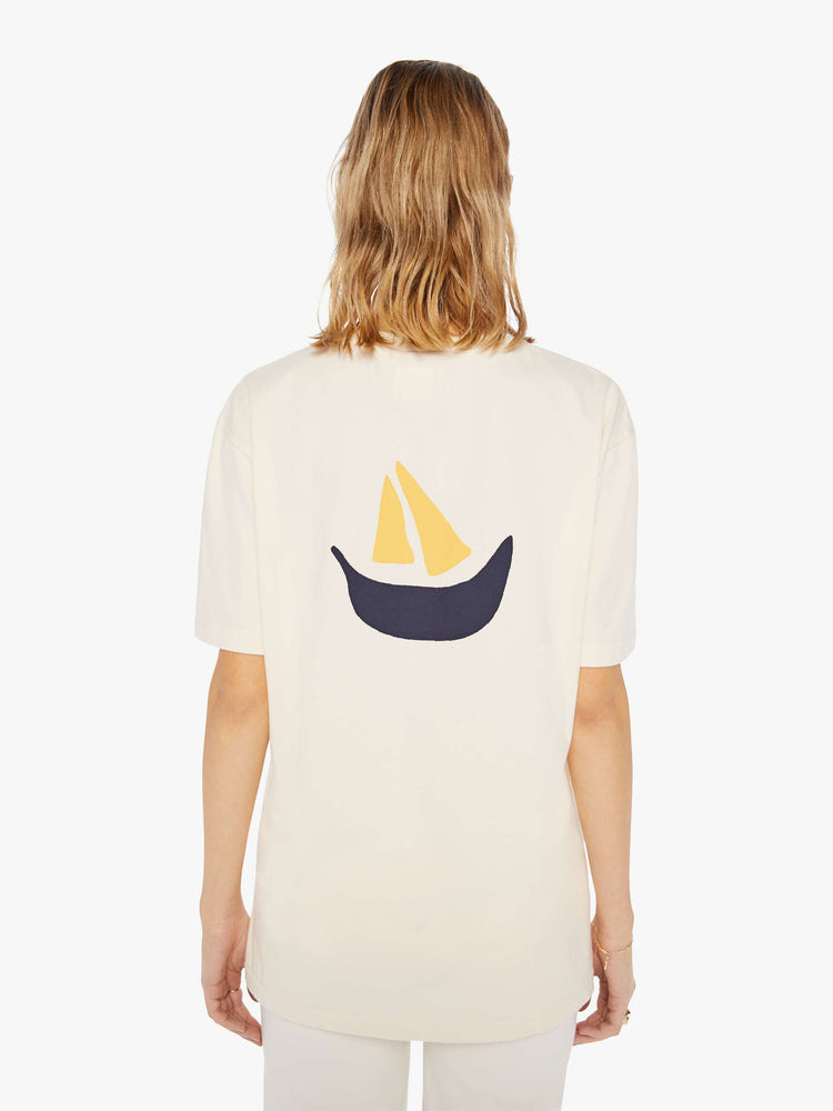 Back view of a womens ecru crew neck tee with a boat graphic printed on the back.