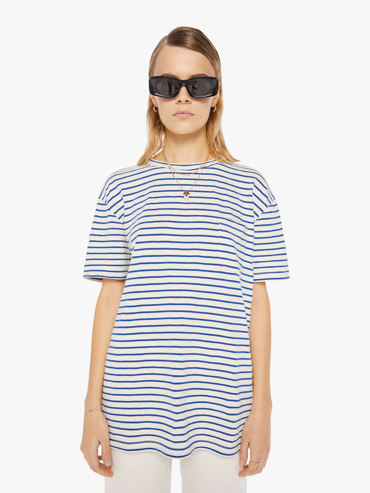 Front view of a womens white crew neck tee with blue stripes and an oversized fit.