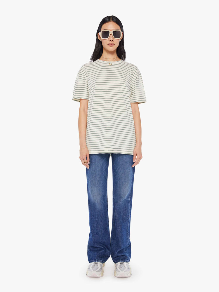 Front full body view of a womens white crew neck tee with green stripes and an oversized fit.