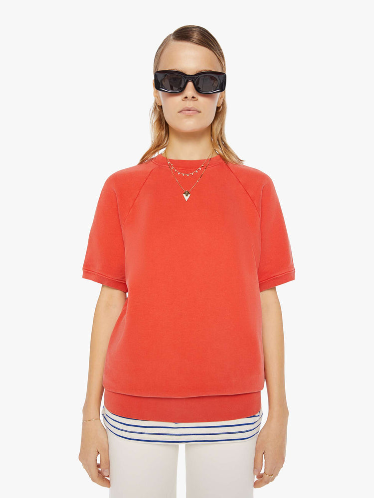 Front view of a womens red short sleeve sweatshirt featuring raglan sleeves.