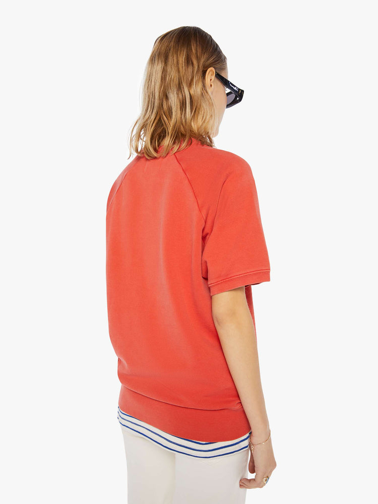 Back view of a womens red short sleeve sweatshirt featuring raglan sleeves.